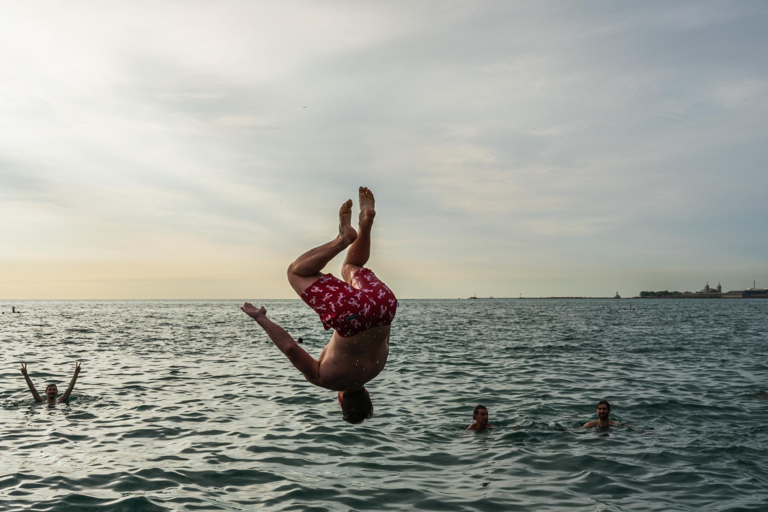 Participant jumps into Lake Michigan for Frosty Fridays near the Lincoln Park Chess Pavilion on June 24, 2026.